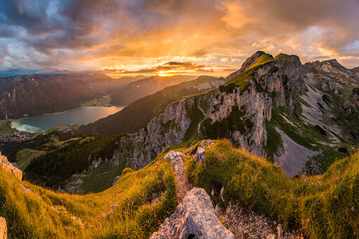 Beautiful view of the natural landscape of the Rofan mountains at Lake Achensee at sunset.